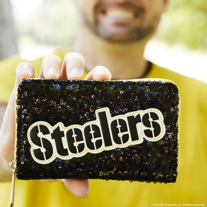 Image of man holding the NFL Pittsburgh Steelers Sequin Wallet out to camera